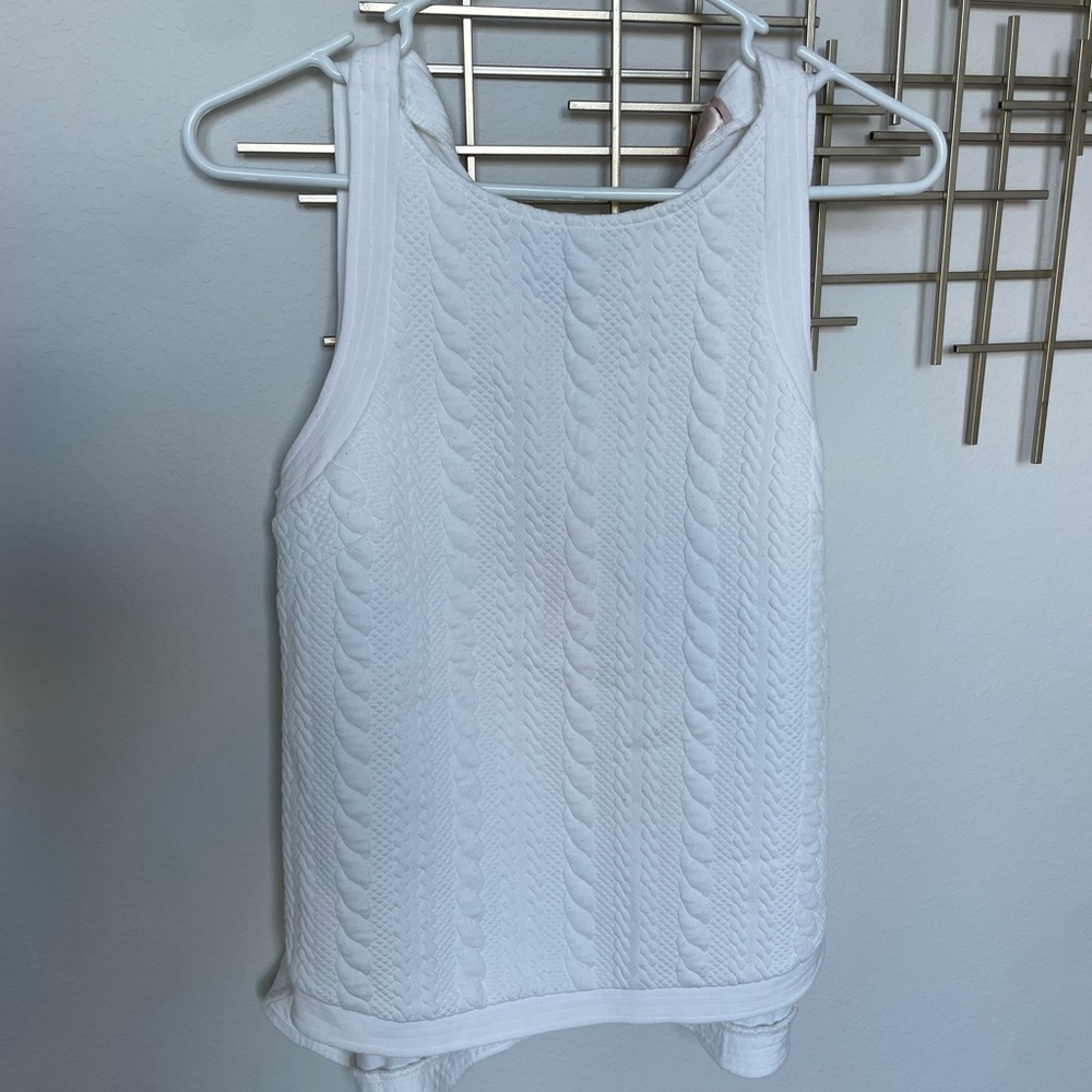White sleeveless top